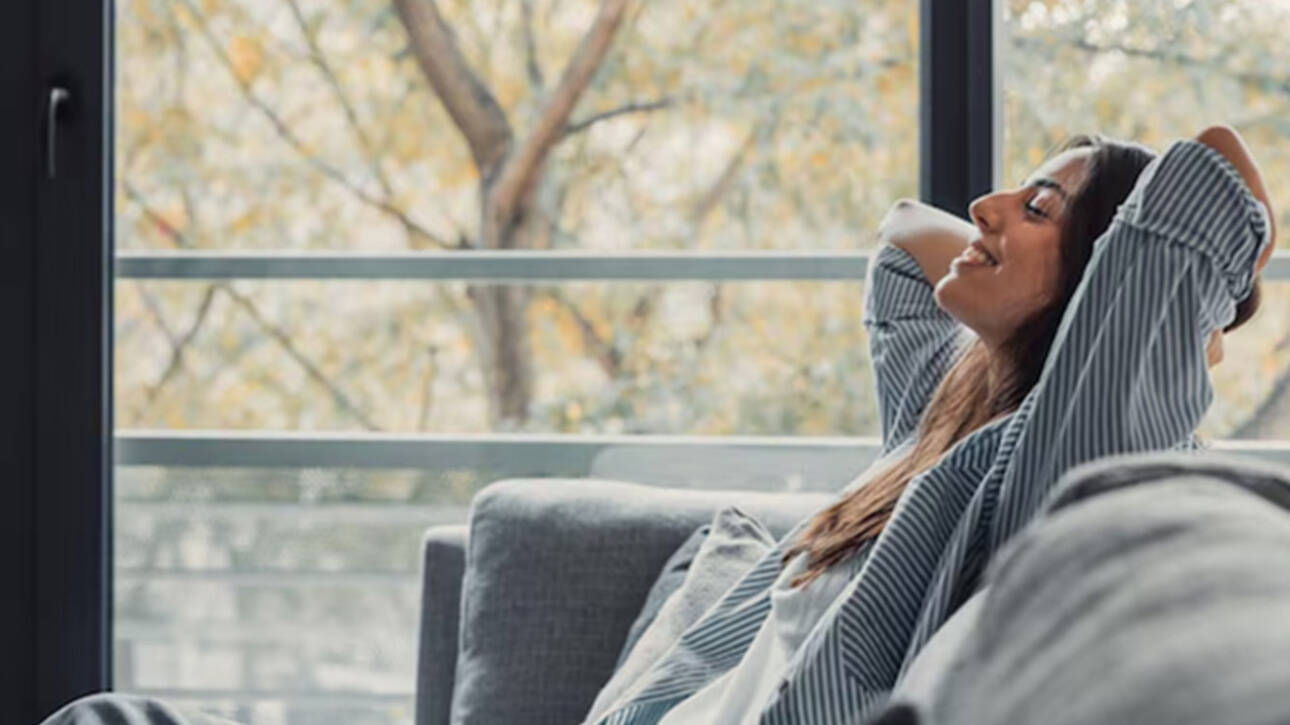 woman relaxing tiny home